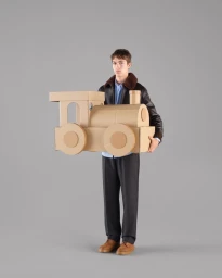 Model Just Verhoeff holds a large sculpted cardboard toy train in a jacket and trousers against a grey backdrop.
