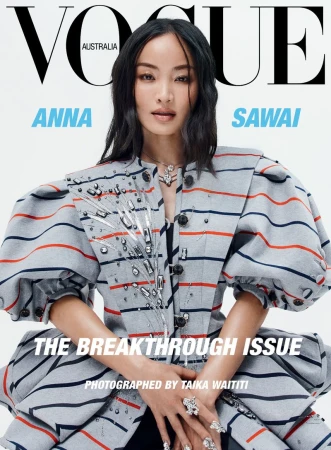 Magazine cover featuring Anna Sawai, Vogue Australia. She's wearing a striped jacket with puffed sleeves, complemented by statement rings and necklace.