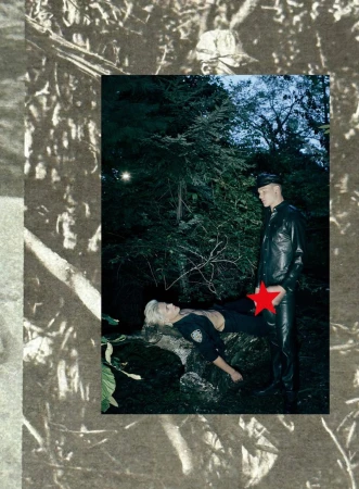 A man in a leather outfit stands over a woman lying on a log in a dark forest setting, creating a striking and edgy composition.