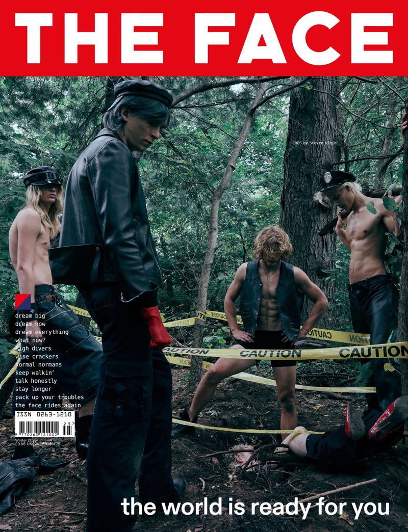 Magazine cover featuring four shirtless men in an outdoor woodland setting with caution tape and a red 'THE FACE' banner at the top.