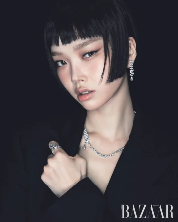 Model with blunt black bob wearing diamond jewellery and a black jacket against a dark background for Harper's Bazaar Korea
