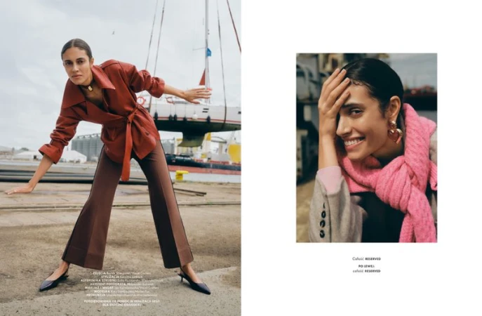 Model in rust belted jacket and brown trousers posing near a sailboat with a second inset portrait showing a pink scarf