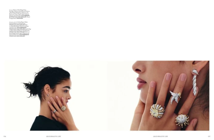 Close-up of two women showcasing luxury jewelry: rings, and earrings, against a bright white background. Jewelry, fashion and beauty.