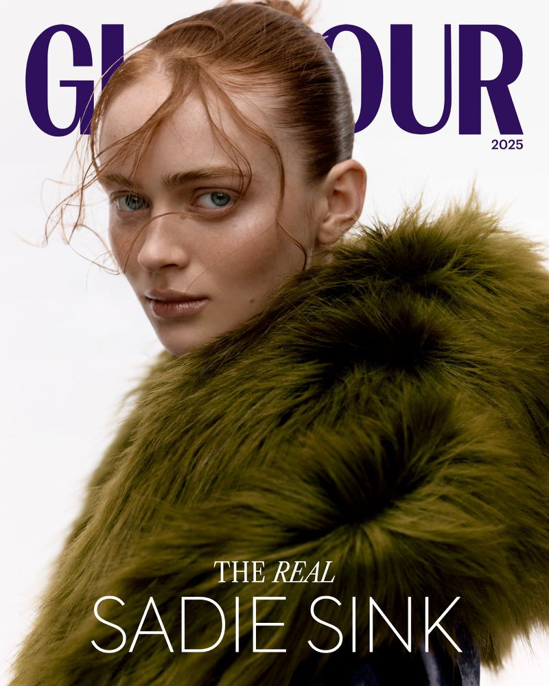 Glamour magazine cover featuring a red-haired adult female wearing a faux fur coat, looking at the camera, set against a clean white background.