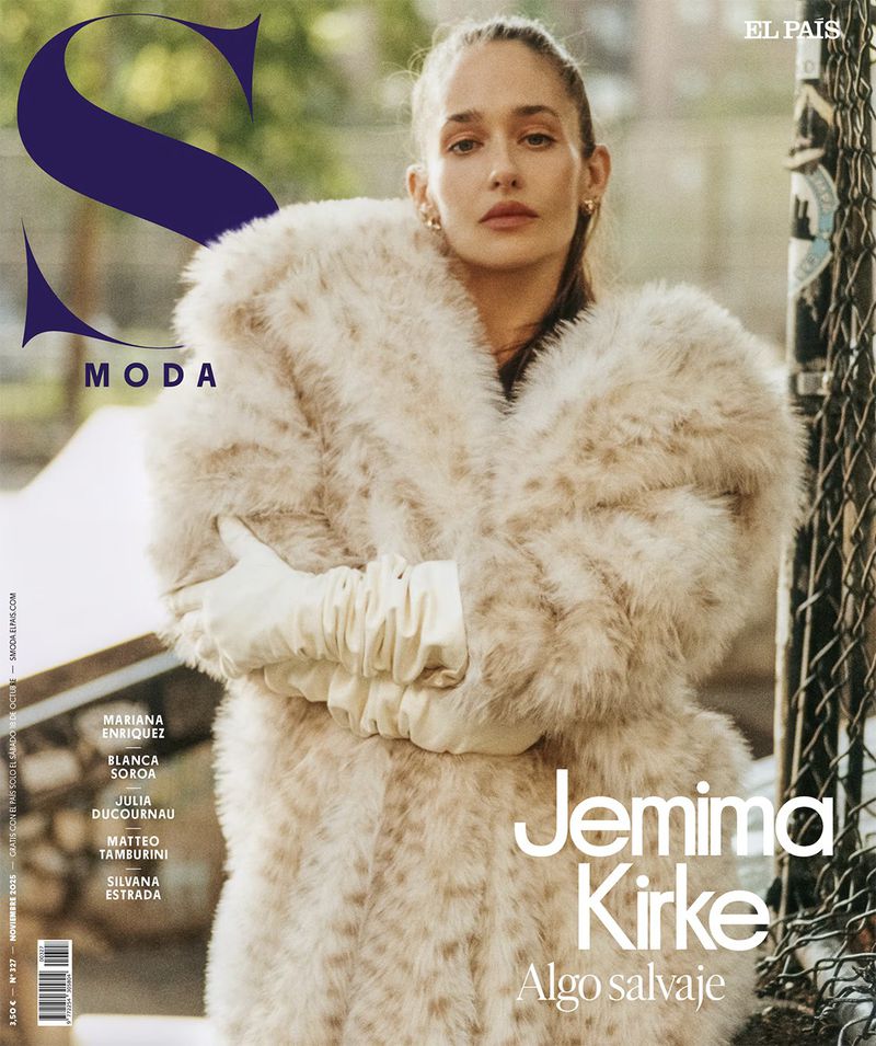 Jemima Kirke poses in a faux fur coat and gloves for a magazine cover, showcasing an urban background and fashion editorial style.