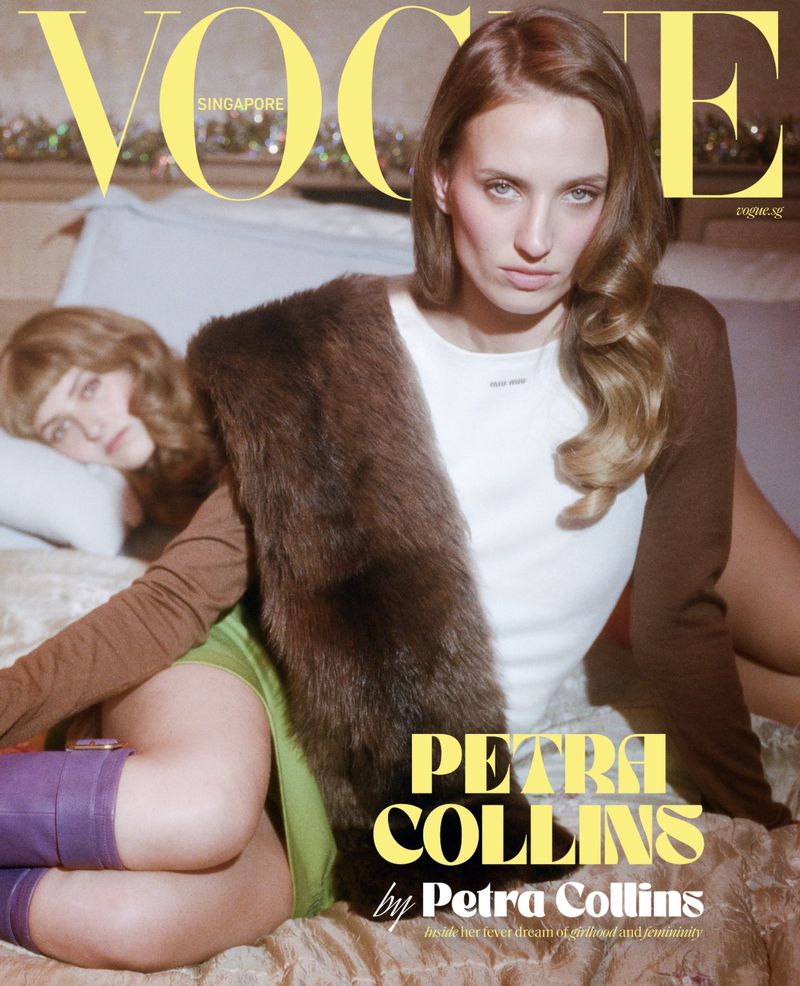 Vogue Singapore cover featuring a posed woman in a brown fur shawl over a white shirt, with a woman reclining in the background.
