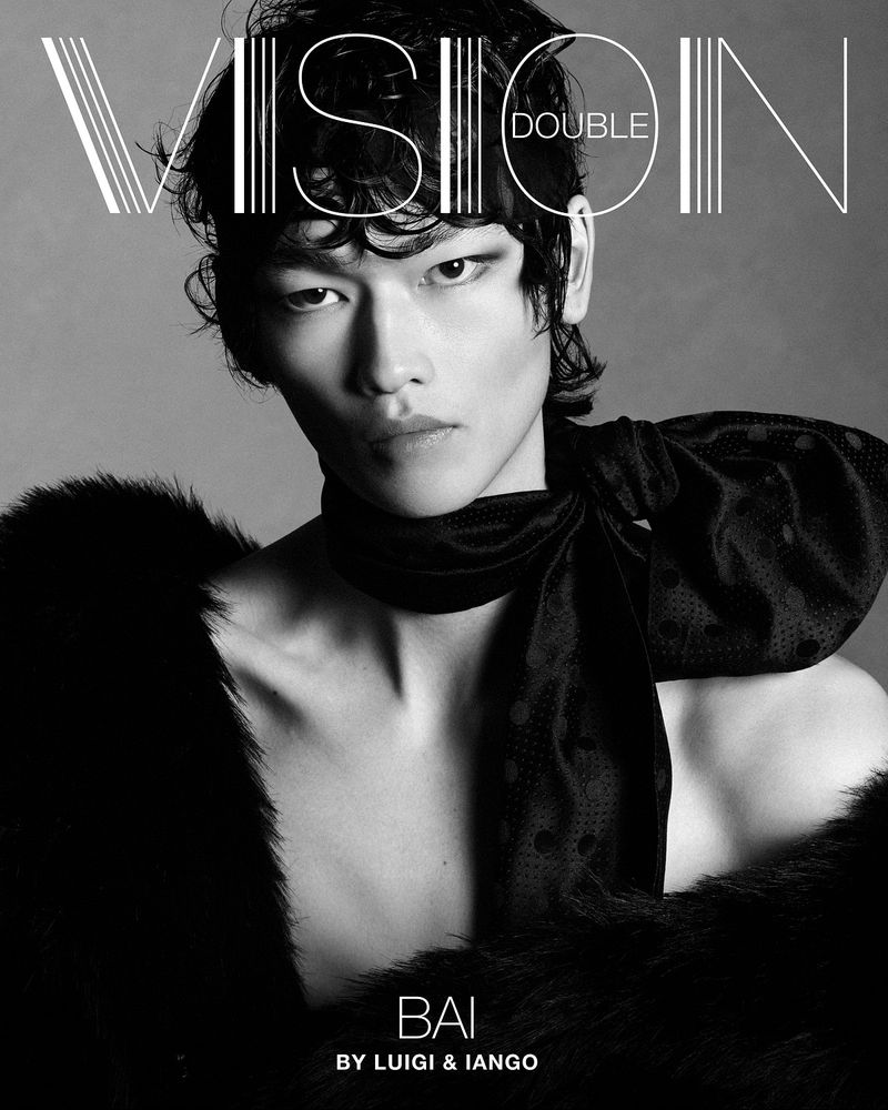 Black-and-white fashion shot of a model with an ornate scarf and fur shawl. Portrait of Bai by Luigi and Iango for VISION Double magazine.