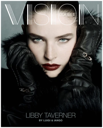 Close-up portrait of Libby Tavener on a magazine cover, wearing a fur-collared jacket and leather gloves. The magazine title reads VISION DOUBLE.