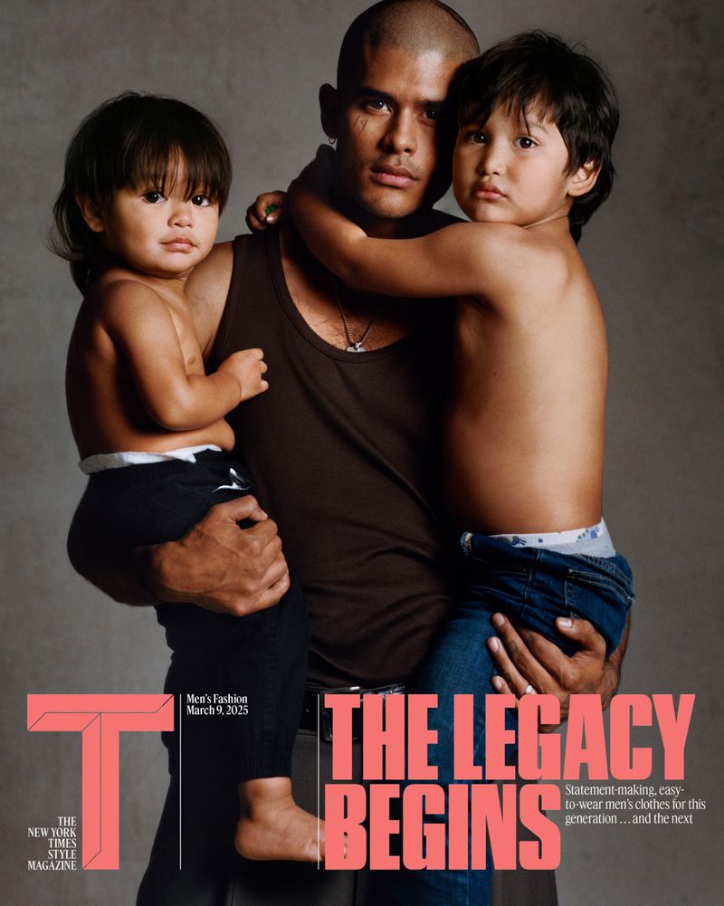 Magazine cover featuring a father holding his two young children in a close-up shot with a neutral background and bold typography.