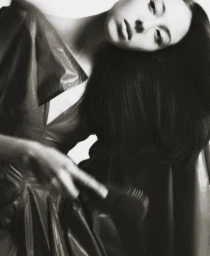 Model Mika Bae in dark attire posing against a plain background for Vogue Thailand editorial