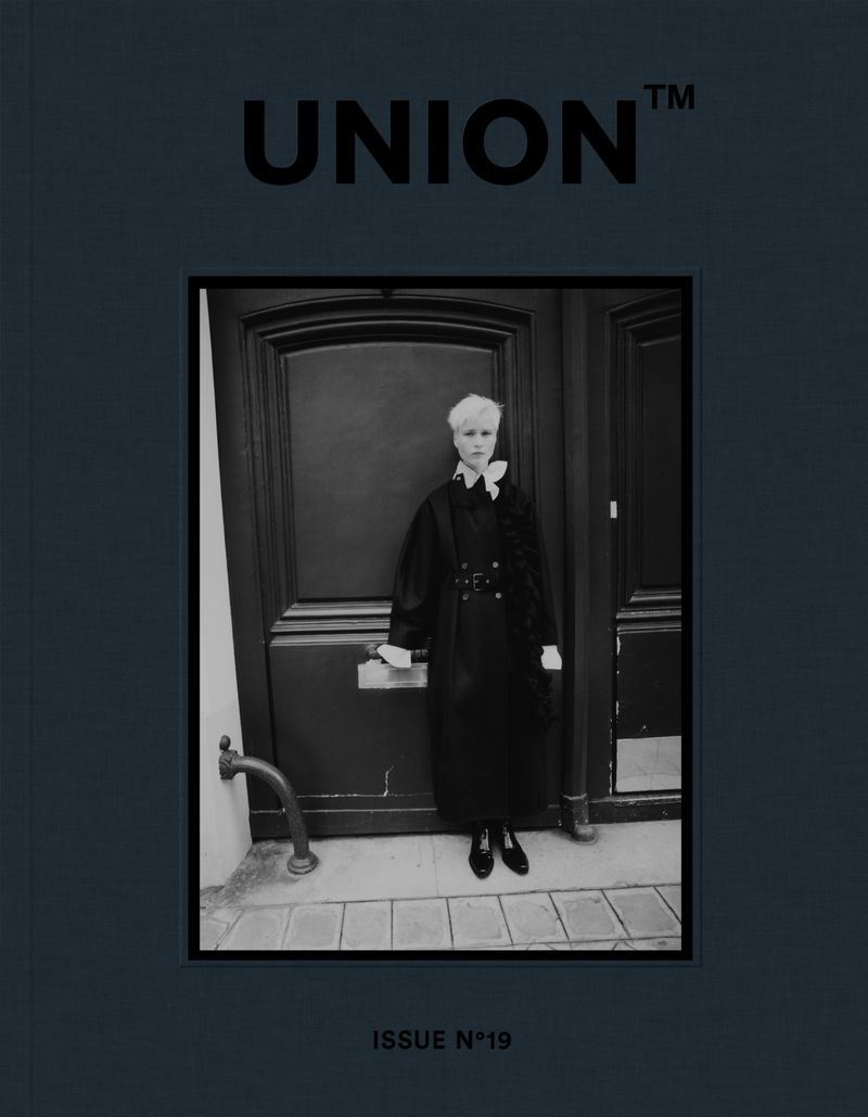 Black-and-white magazine cover featuring a person in a dark coat, standing in front of a dark door, with 'UNION' and 'ISSUE N°19' text.