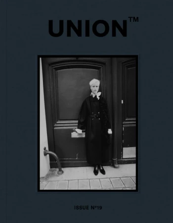 Black-and-white magazine cover featuring a person in a dark coat, standing in front of a dark door, with 'UNION' and 'ISSUE N°19' text.