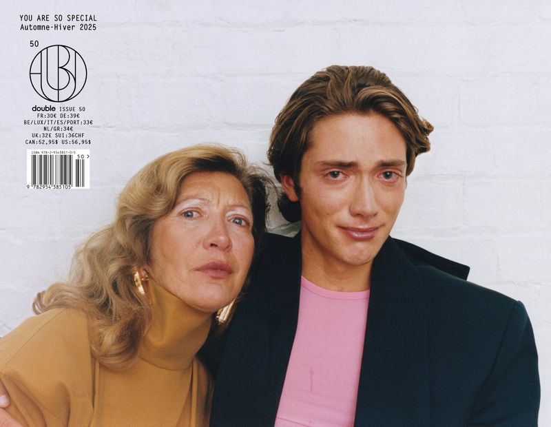 Magazine cover featuring a young adult and an older adult with tan skin, in front of a white wall, with visible text and colors.