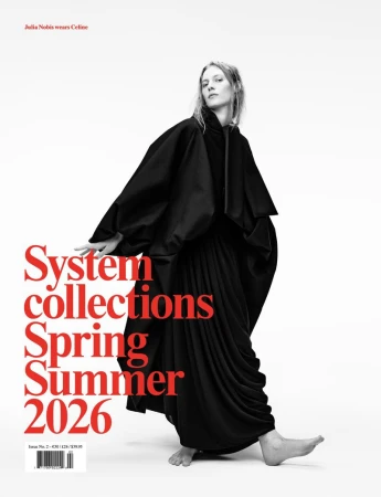 Fashion model Julia Nobis in a black dress and shawl poses against a white background for a magazine cover promoting Spring/Summer 2026 collections.