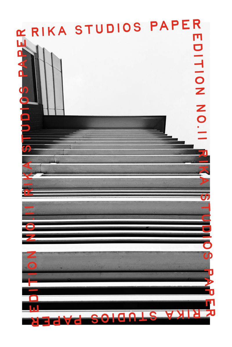 Black and white photograph of concrete stairs and building, framed by red text; 'Rika Studios Paper Edition No. II'.