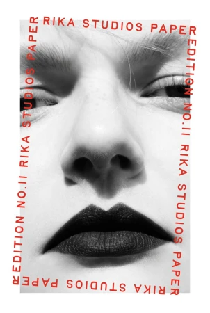 Close-up black and white portrait of a model with dark lipstick and red editorial framing text for Rika Studios Paper No. 11.