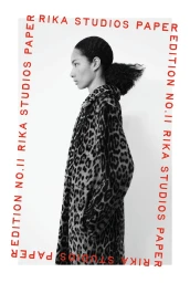 Black and white profile portrait of a woman in a leopard print coat bordered by red Rika Studios Paper text on a white backdrop.