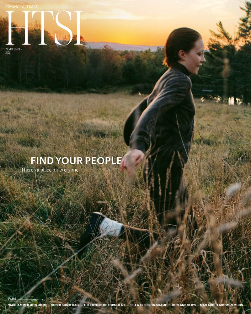 Magazine cover featuring a woman in a dark outfit running through a grassy field at sunset, with a forest and horizon in the background.
