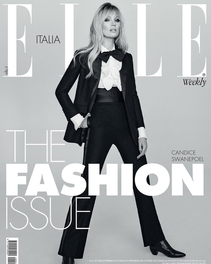Elle Italia cover featuring Candice Swanepoel in a black suit with a white ruffled shirt and bow tie, posing against a gray backdrop.