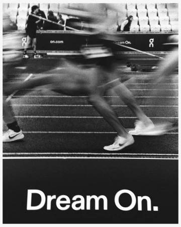 Monochrome action shot of runners on a track. 'Dream On.' is visible in bold letters below them. Motion blur emphasizes speed.
