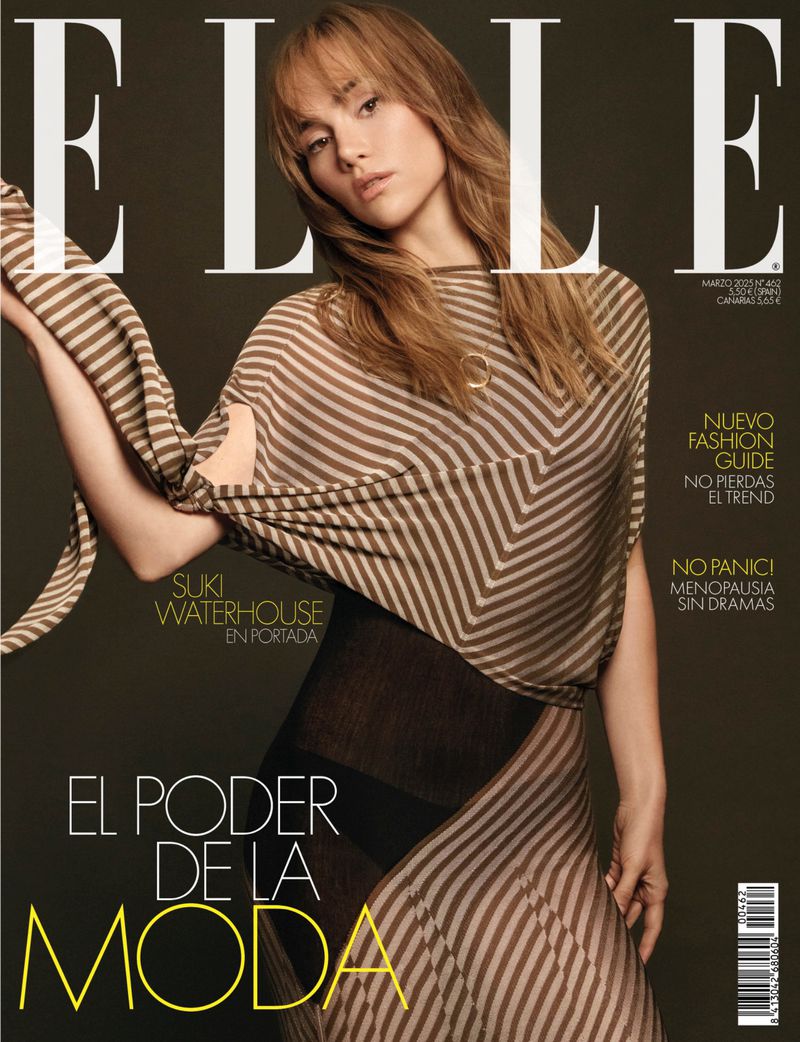 Elle Magazine cover featuring Suki Waterhouse with striped top and skirt in a studio setting, captured in a medium shot.