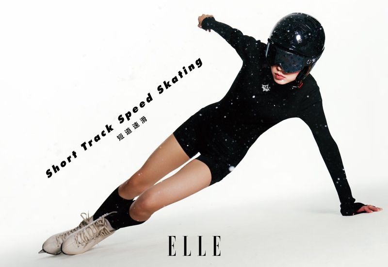 A young woman in a black speed skating suit and helmet is leaning into a turn, showcasing athletic prowess and fashion for a magazine spread.