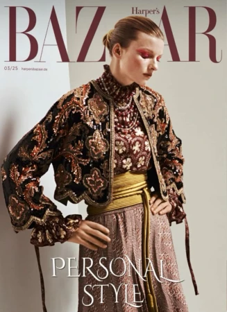 Fashion editorial cover of Harper's Bazaar magazine featuring a model wearing a sequined jacket and skirt with a gold belt against a neutral backdrop.