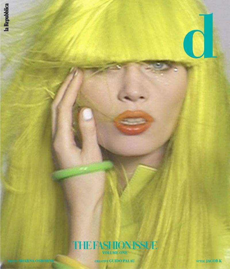 Fashion magazine cover featuring a woman with neon yellow hair and orange lipstick, accessorized with green bracelets and a neon top.