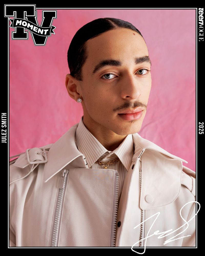 Portrait of Jules Smith wearing a cream trench coat against a pink backdrop, framed by a black border with text.