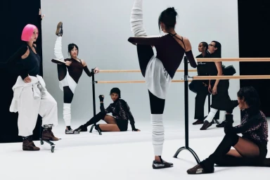 Group of diverse female models posing near a ballet barre in a white studio for Puma Speedcat campaign