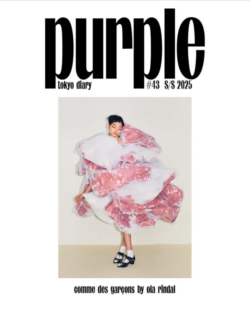 Purple Magazine cover with a young fashion model wearing an avant-garde, pink and white flower-like dress by Comme des Garçons.