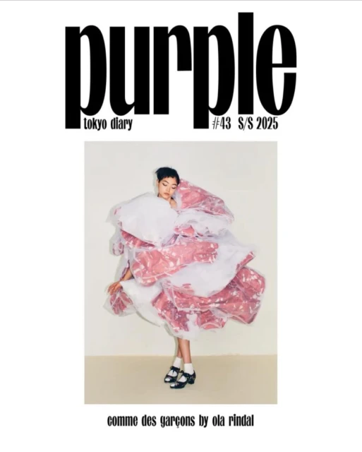 Purple Magazine cover with a young fashion model wearing an avant-garde, pink and white flower-like dress by Comme des Garçons.