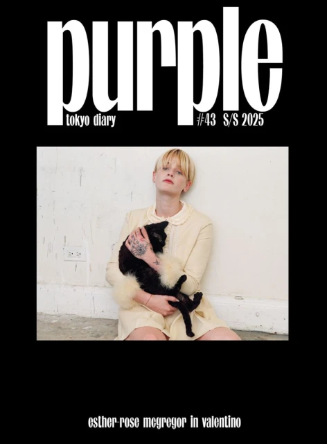Magazine cover featuring a woman in a cream dress holding a black cat in an indoor studio setting, 'Purple' magazine, Tokyo Diary, S/S 2025.