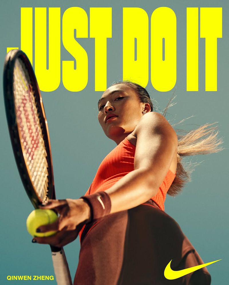 Female athlete in sportswear holding tennis racket and ball. Sports-themed campaign with a low-angle shot against a sky background.