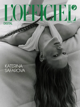 Monochrome magazine cover featuring Katerina Safarova lying upside down wearing a white top