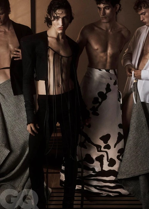 Male models posing in avant-garde tailoring and draped patterned fabrics for a GQ Mexico fashion editorial.