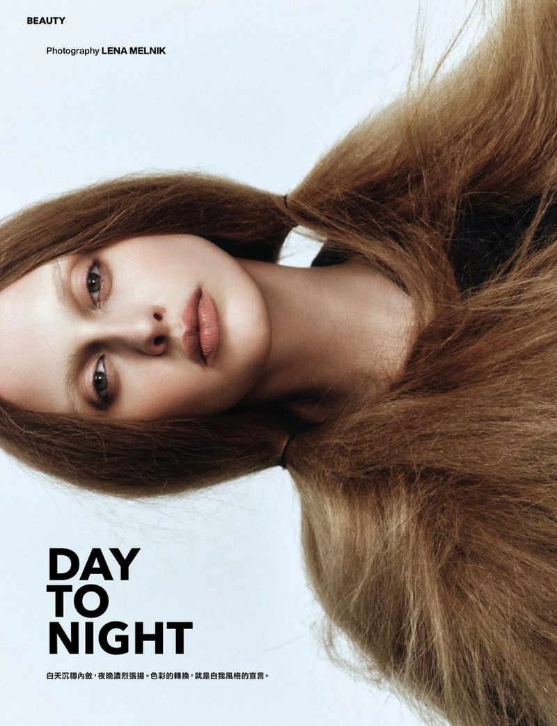 Model Julia Bregalda with voluminous textured light brown hair against a bright white studio background.