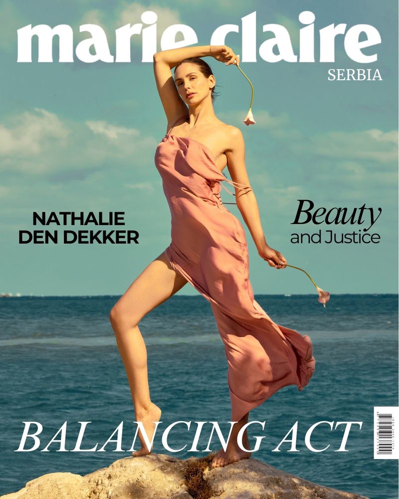 Marie Claire Serbia magazine cover featuring model Nathalie Den Dekker in a flowing pink dress holding a flower at the ocean.