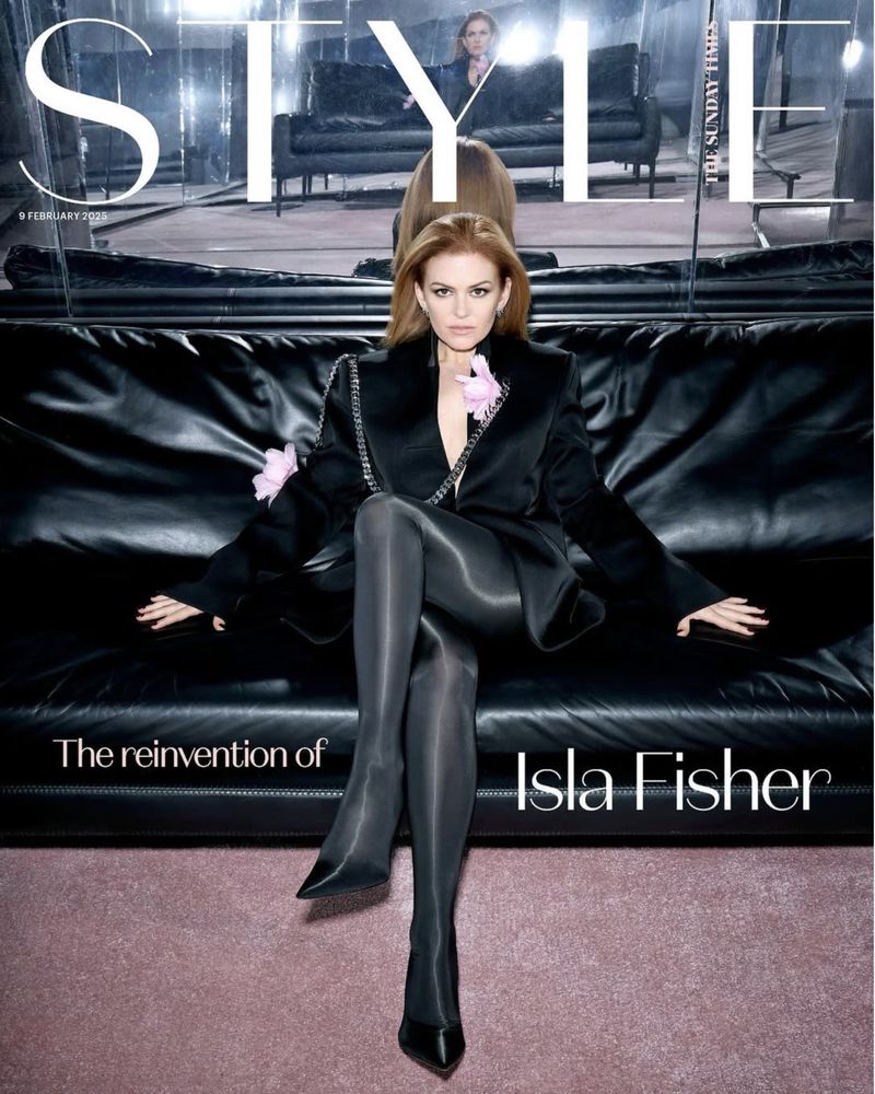 Magazine cover featuring Isla Fisher in a black jacket and tights, seated on a leather couch, with 'STYLE' logo prominently displayed.