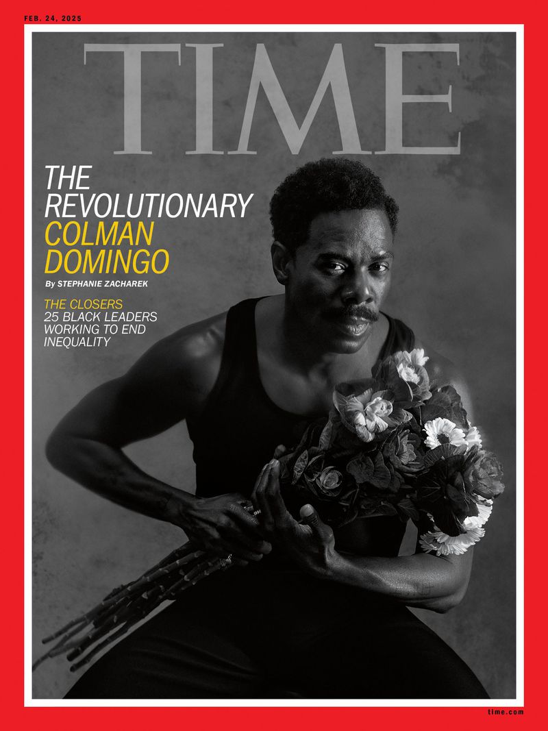 Magazine cover featuring a Black man, Colman Domingo, holding flowers against a grey backdrop in a red frame, promoting a story on Black leaders.