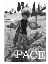 Model Maria Araujo in a ruffled cutout dress with voluminous hair in a rural field for Marie Claire Italia editorial.
