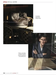 Editorial layout for Le Point featuring model Thibaud Charon in a navy blazer seated at a café table alongside a woven leather tote bag.