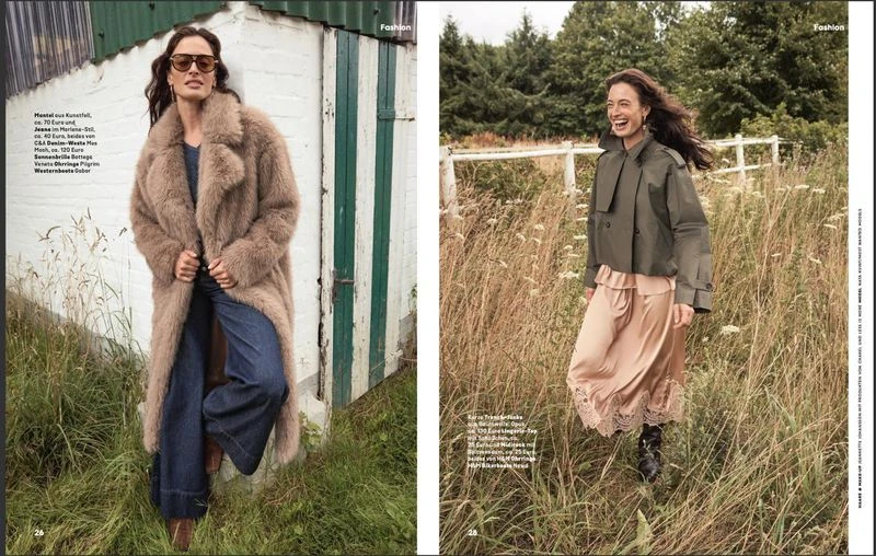 Fashion editorial shot of a woman in a long faux fur coat next to a green and white wall, and a woman in an olive jacket in a field.