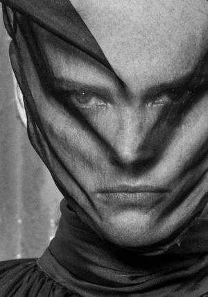 Close up monochrome portrait of a model wearing a sheer black veil draped tightly over her face for A Part Publications