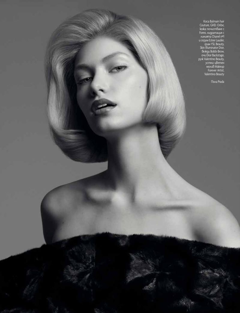 Black and white portrait of a fair-skinned adult woman with blonde hair and black fur garment. Fashion and beauty aesthetic.