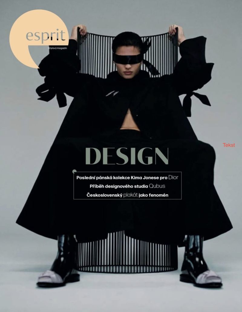 Esprit magazine cover features a woman wearing black coat and futuristic visor, seated in front of a black and white striped backdrop.