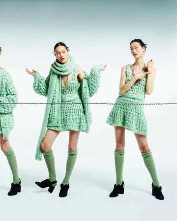 Three images of the same young adult woman posing in a knitted miniskirt and cardigan sweater with matching knee socks and black heels.
