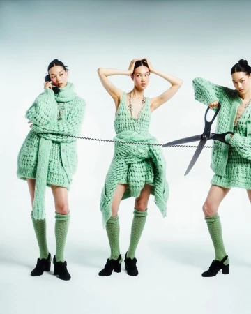 Fashion model Chloe Oh depicted in three composite poses wearing mint green knitwear with a telephone cord and oversized scissors.
