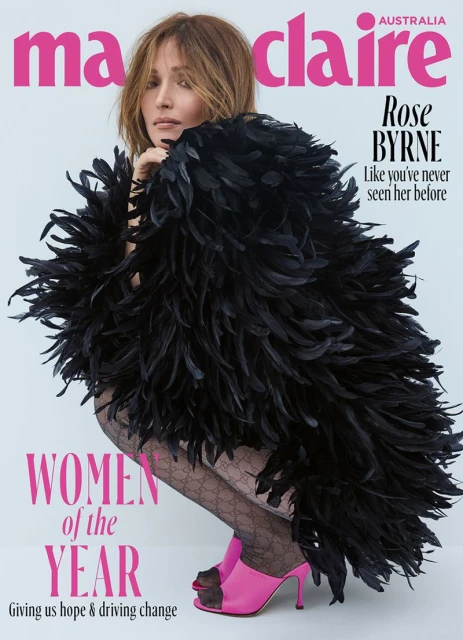 Magazine cover featuring Rose Byrne in black feathered garment, pink heels against a bright white background. 'Marie Claire' masthead.