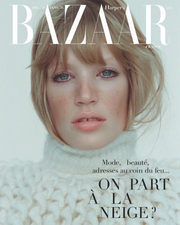Bazaar magazine cover featuring a fair-skinned woman with blonde hair wearing a white knit sweater, close-up shot in a photo studio.